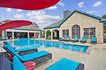 Sparking pool with water feature and lounge seating